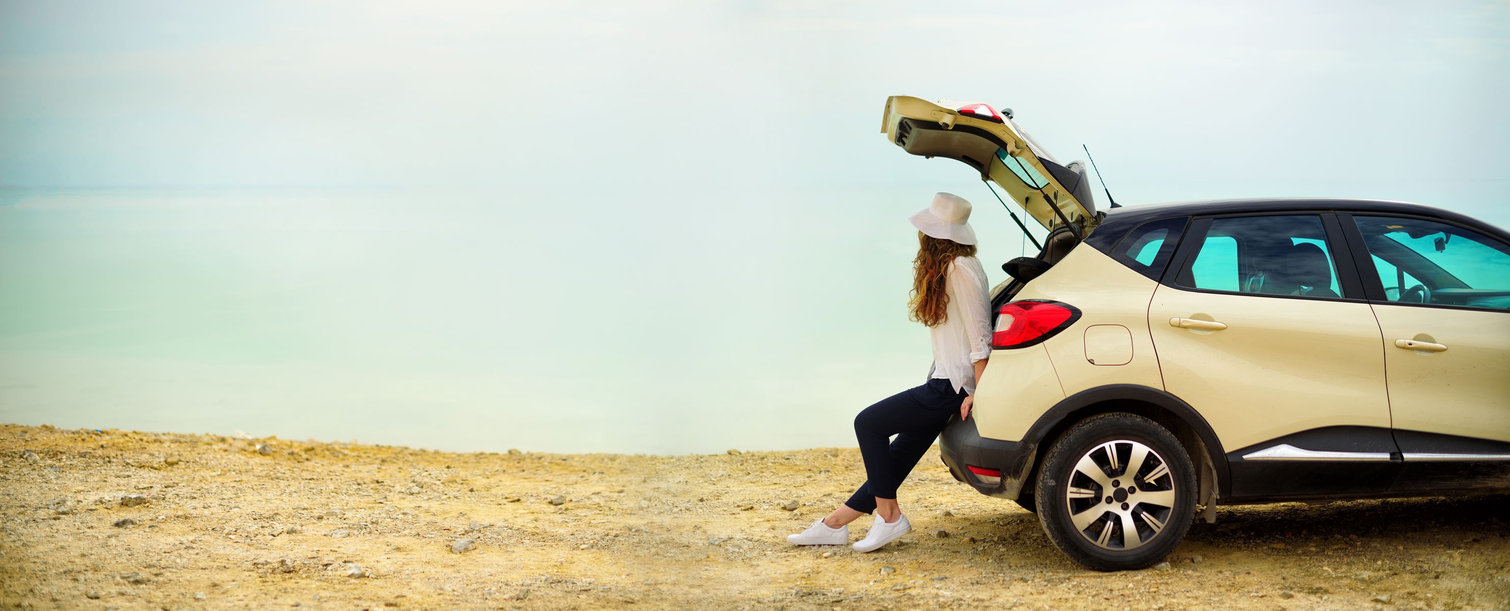 Woman sitting in the back of a car