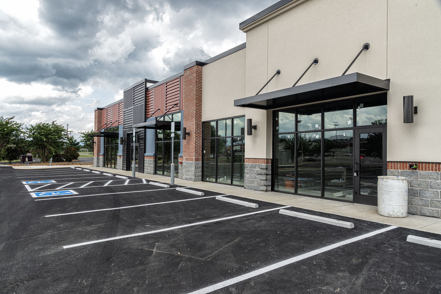 retail stores in front of empty parking lot